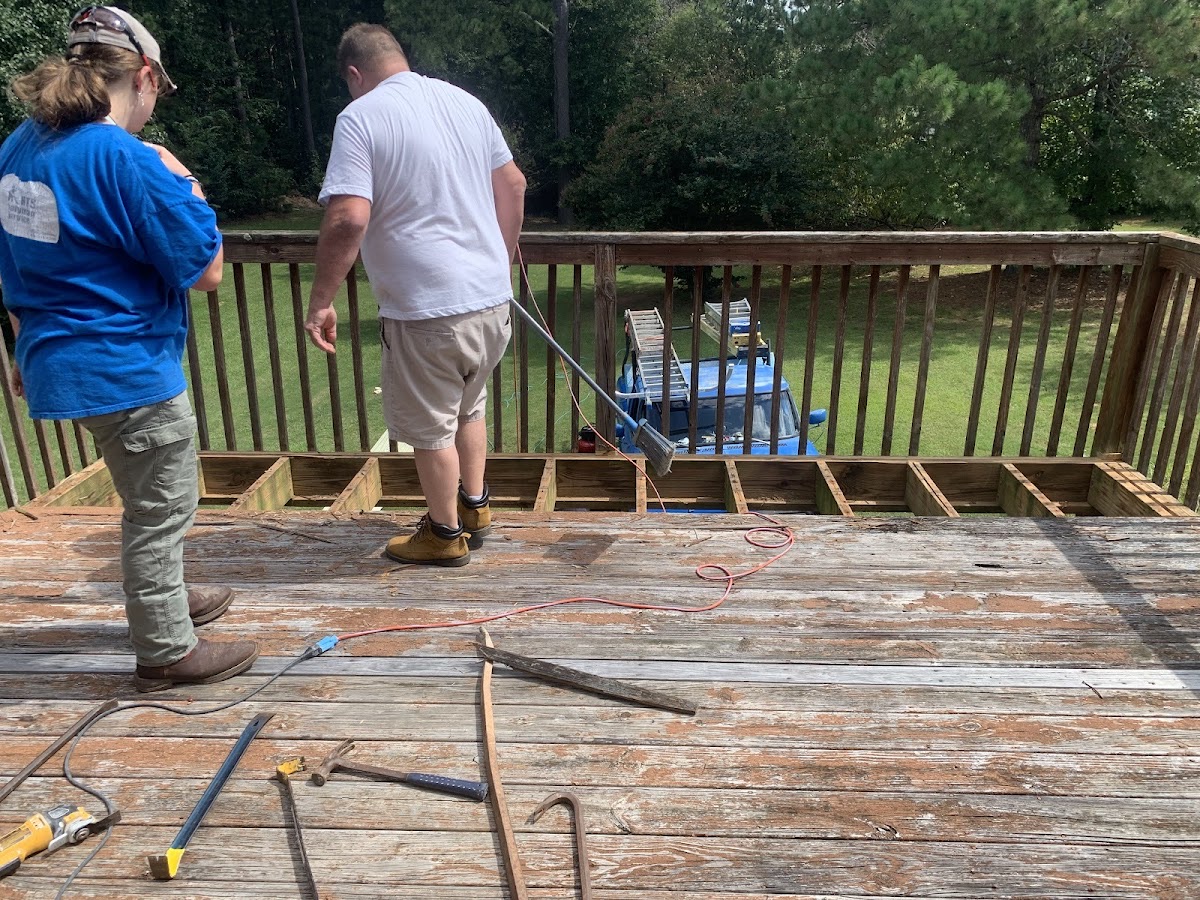 H.T.S Handyman Service rebuilding a backyard deck, replacing the joists and boards
