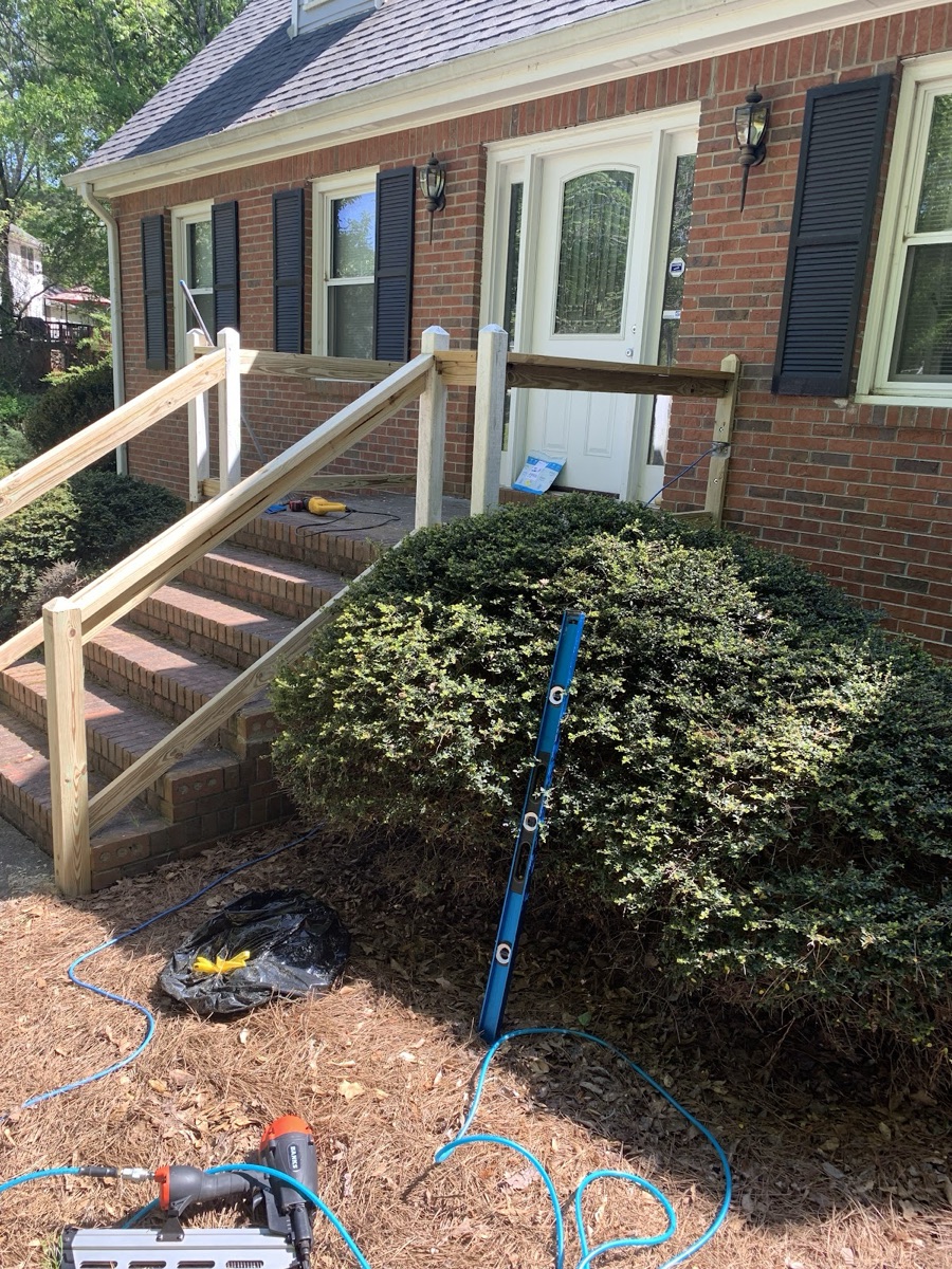 A freshly built wood handrail and steps installed at a Stockbridge home by H.T.S Handyman Service